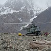 Arrived in central Tian Shan. The huge Soviet helicopter makes so much wind, that all people near the machine have to duck down to the ground.